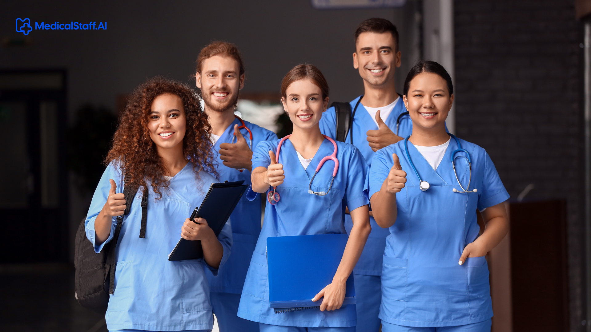 Healthcare professionals in medical uniforms smiling together